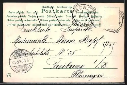 Lithographie Osterküken mit bunten Ostereiern vor einer Mauer