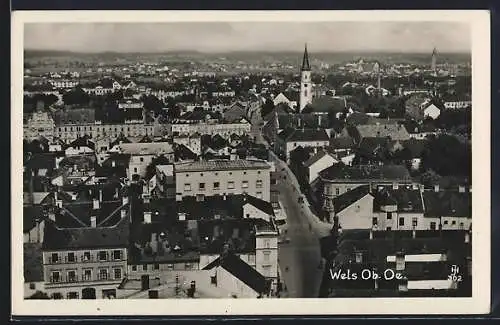 AK Wels /Ob.-Oe., Teilansicht mit Kirche und Strassenpartie