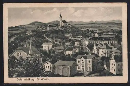 Künstler-AK Ostermiething /Ob.-Oest., Teilansicht mit Kirche