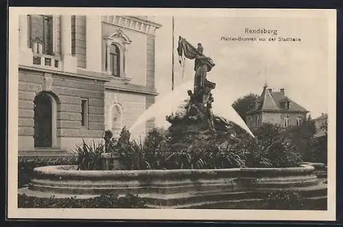 AK Rendsburg, Pfähler-Brunnen vor der Stadthalle mit Blick auf eine Villa