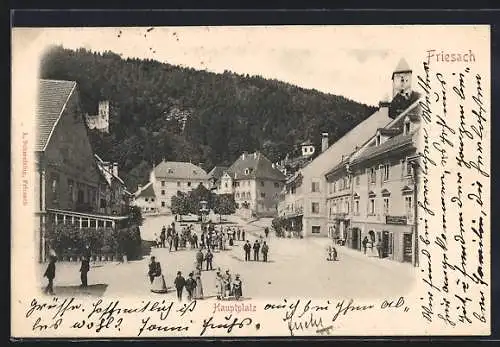 AK Friesach, Hauptplatz mit Geschäften und Ruine