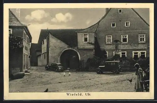 AK Wipfeld /Ufr., Ortspartie mit Kriegerdenkmal