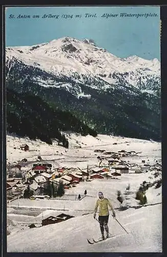 AK St. Anton am Arlberg, Skiläufer vor dem verschneiten Ort