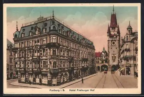 AK Freiburg i. B., Hotel Freiburger Hof mit Strassenbahnen