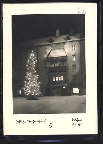 Foto-AK Adalbert Defner: Geschmückter Weihnachtsbaum vor dem Geschäft von Josef Jabinger