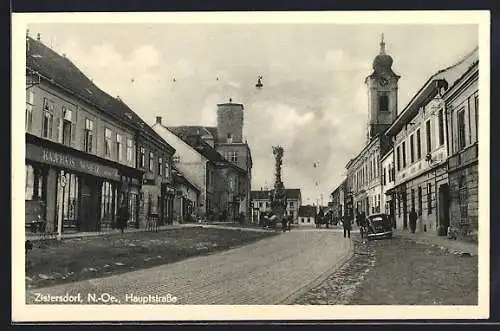 AK Zistersdorf, Hauptstrasse mit Kaufhaus und Kirchturm