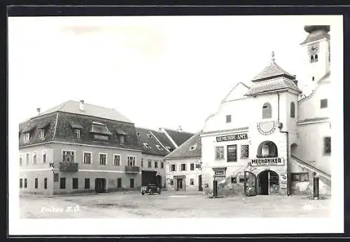 AK Pulkau /N.-Ö, Platzpartie mit Gemeinde-Amt und Mechaniker-Werkstatt Johann Duben, Uhrenturm