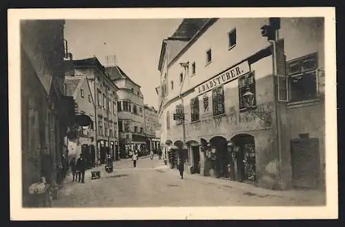 AK Krems /Wachau, Strassenpartie am Geschäft J. Badstuber