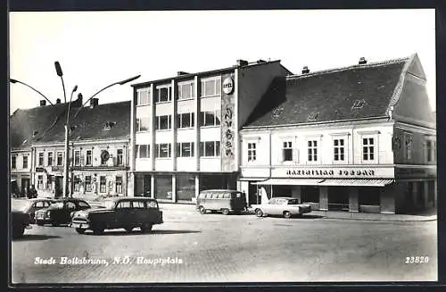 AK Hollabrunn, Hauptplatz mit Geschäften, VW Bulli T Bus vor Opel Vertretung