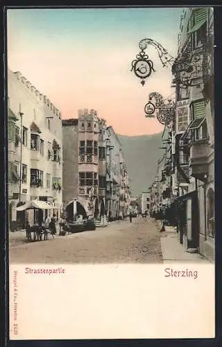 AK Sterzing, Strassenpartie mit Geschäften, um 1900