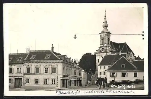 AK Gr.-Siegharts, Kaufhaus Adalbert Asser und Kirche