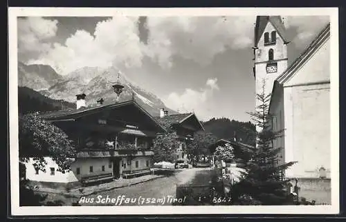 AK Scheffau, Strassenpartie mit Kirche