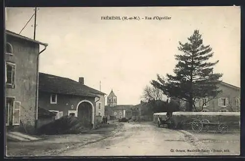 AK Frémenil, Rue d`Ogeviller avec maisons et charrette dans un village rural