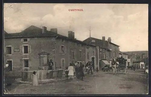 AK Custines, Scène de rue animée avec fontaine et charrette