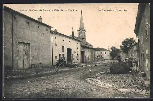 AK Fléville, Une rue avec église et charrette