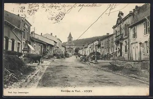 AK Lucey, Vue de la rue principale avec église au fond et villageois animés