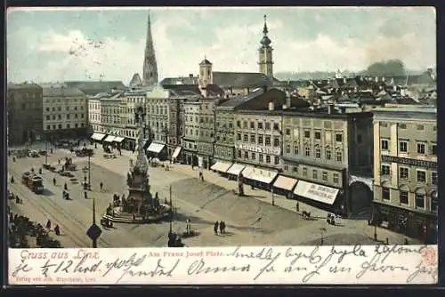 AK Linz, Am Franz Josef-Platz mit Geschäften und Strassenbahn