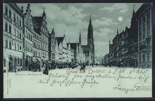 Mondschein-AK Landshut, Strasse in der Altstadt mit Geschäften und Martinskirche