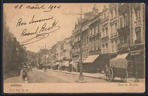 AK Amiens, Rue de Noyon animée avec passants et charrette