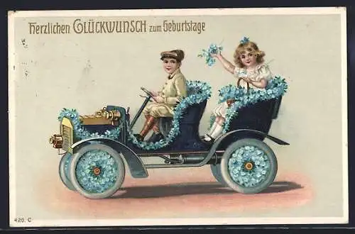 AK Knabe und Mädchen im Auto, Blumenschmuck Vergissmeinnicht