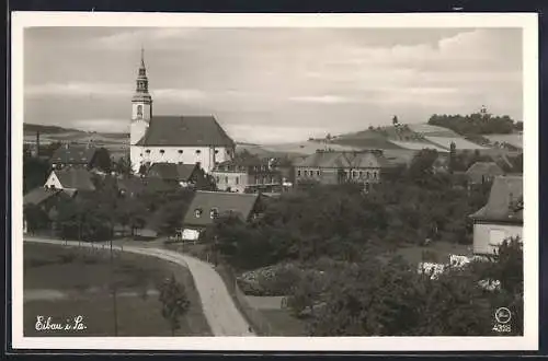 AK Eibau i. Sa., Strassenpartie mit Kirche