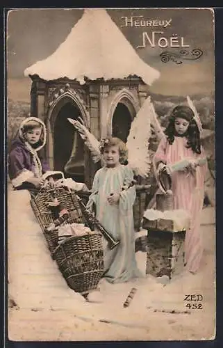 AK Weihnachtsengel vor einem verschneiten Glockenturm, Heureux Noel