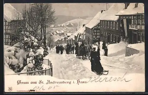 AK St. Andreasberg, Menschen mit Schlitten auf der eingeschneiten Strasse