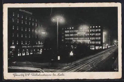 AK Gleiwitz, Wilhelmstrasse bei Nacht mit Cafe Haus Oberschlesien