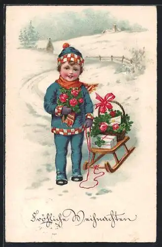 AK Junge mit Geschenk für Weihnachten auf seinem Schlitten