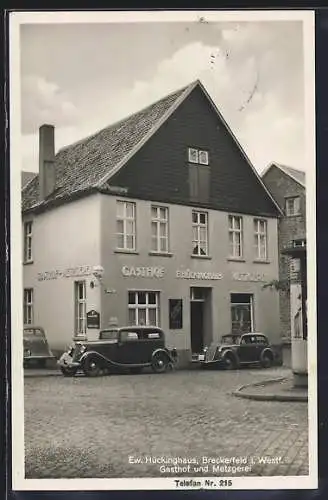 AK Breckerfeld i. Westf., Gasthof-Metzgerei Ew. Hückinghaus, Ansicht von der Strasse mit Automobilen u. Litfasssäule