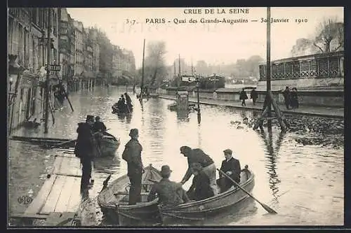 AK Paris, Crue de la Seine 1910 au Quai des Grands-Augustins, barques sur la rue inondée