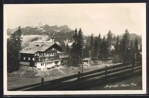 AK Schwaz, Gasthaus Grafenast mit den Bergen