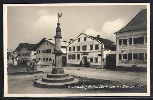 AK Putzleinsdorf, Marktplatz mit Pranger