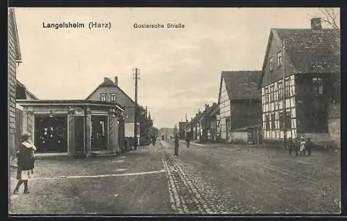 AK Langelsheim /Harz, Goslarsche Strasse mit Geschäft und Passanten