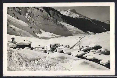 AK Stuben am Arlberg, Ortsansicht im Winter