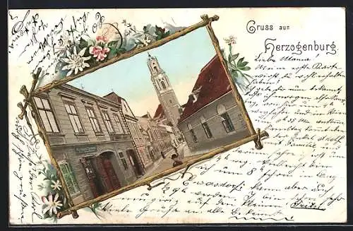 AK Herzogenburg, Strassenpartie mit Blick zur Kirche im floralen Passepartout