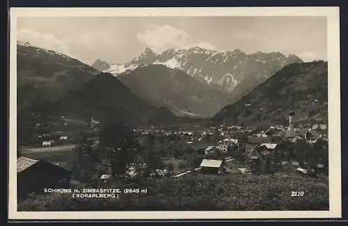 AK Schruns /Vorarlberg, Ortsansicht mit Kirche und Sicht auf die Zimbaspitze