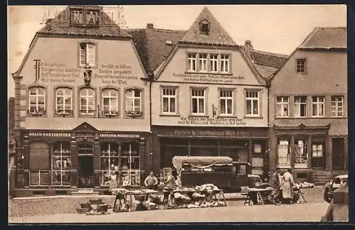AK St. Wendel, Häuser mit Bekenntnissprüchen am Domplatz mit Geschäften