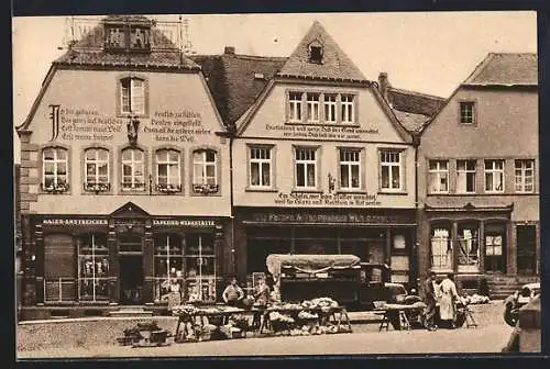 AK St. Wendel, Häuser mit Bekenntnissprüchen am Domplatz mit Geschäften