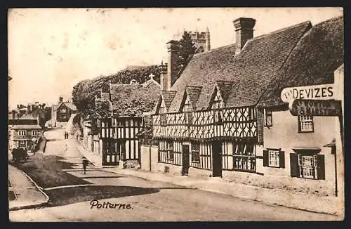 AK Potterne, Strassenansicht mit Fachwerkhäusern