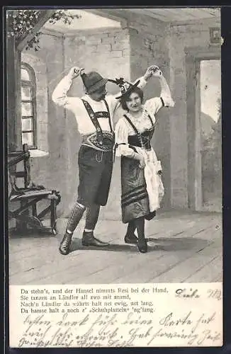 AK Mann und Frau in Trachten tanzen miteinander