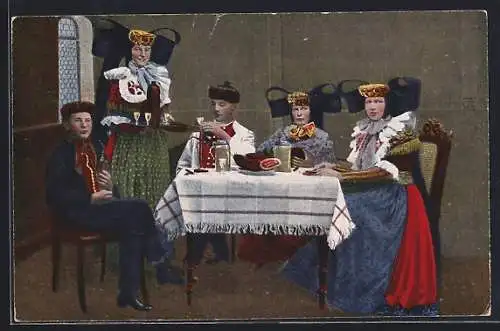 AK Frauen in Volkstrachten am Esstisch, Tracht Schaumburg-Lippe