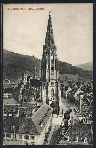 AK Freiburg i. Br., Münster mit Strassenpartie