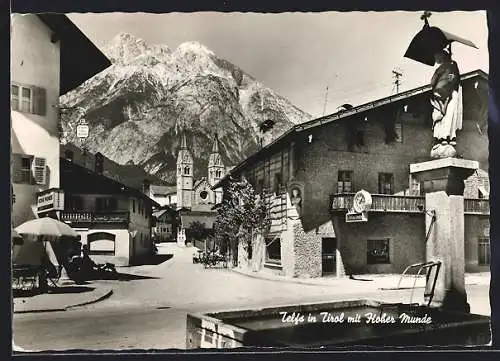 AK Telfs in Tirol, Gasthof Hohe Munde mit Blick auf die Kirche