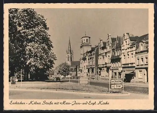 AK Euskirchen, Kölner Strasse mit Herz- Jesu- und evangelischer Kirche