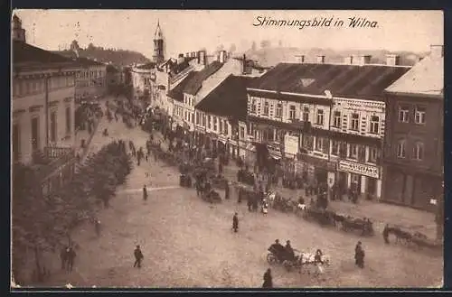 AK Wilna, Strassenpartie mit Geschäften und Passanten