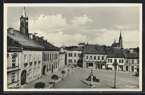 AK Wigstadtl, Ringplatz mit Geschäften und parkendem Auto