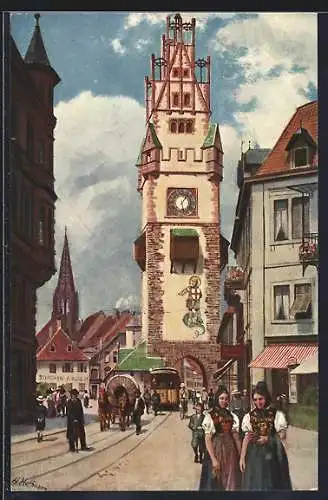 Künstler-AK Freiburg / Br., Schwabentor, Frauen in Tracht und Strassenbahn
