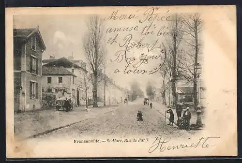 AK Franconville, Rue de Paris animée avec passants et arbres alignés