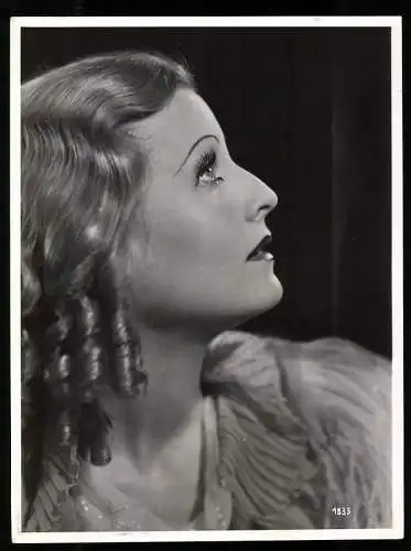 Fotografie Schauspielerin Lilian Harvey im Seitenprofil mit Korkenzieherlocken
